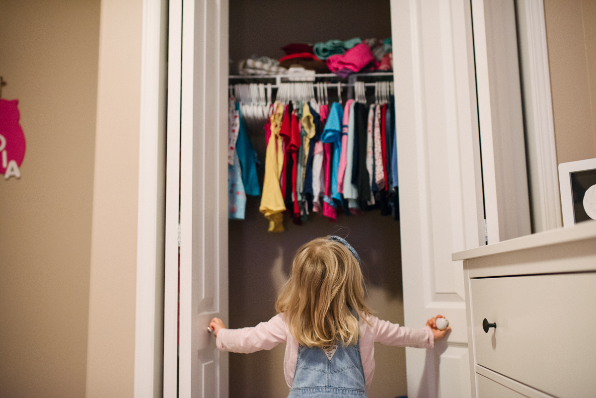 Girl looking in her wardrobe