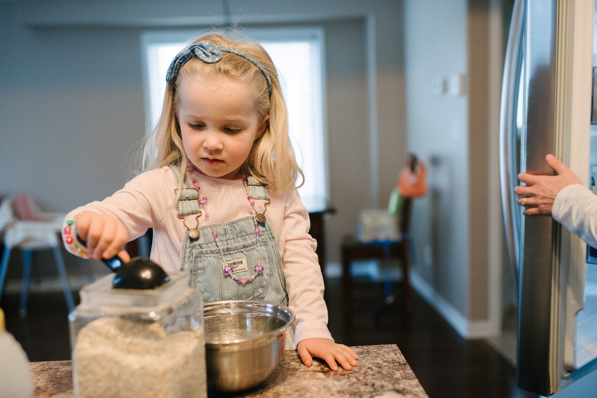 Young girl cooking in the kitchen