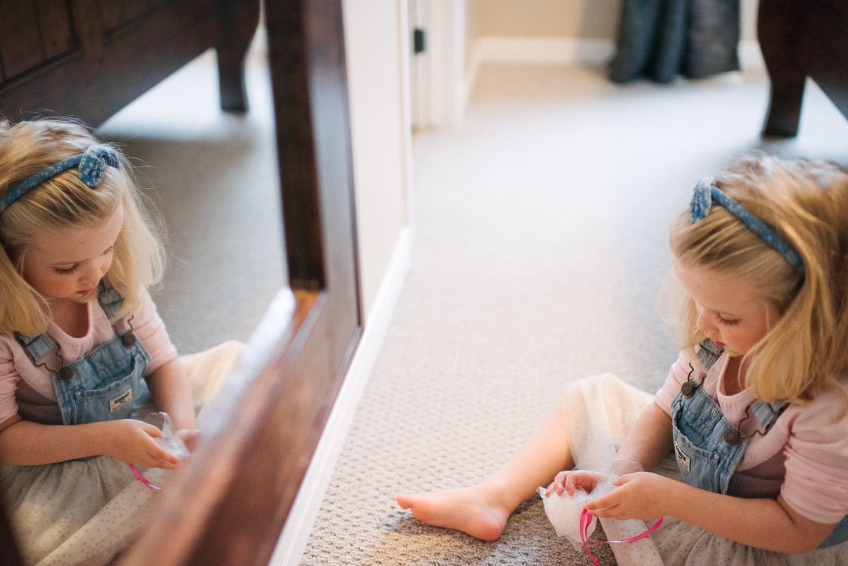 Girl looking into mirror