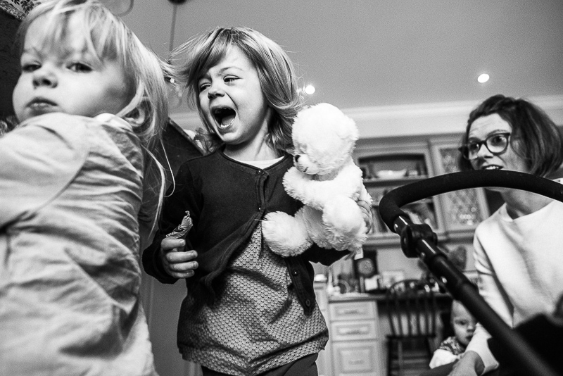 young sisters fight during family documentary photography session