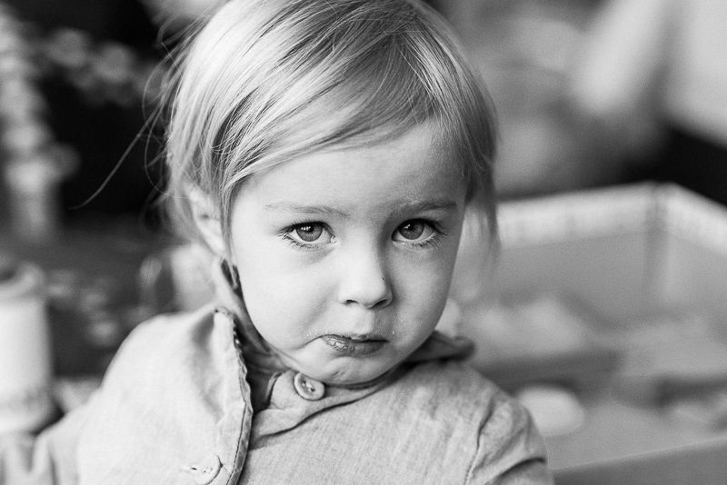 candid portrait in black and white of young girl 