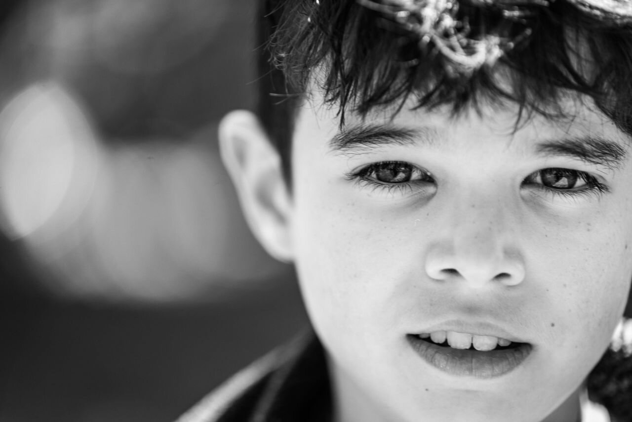 Portrait of a young boy at a documentary family photography session in Kingston, Ontario