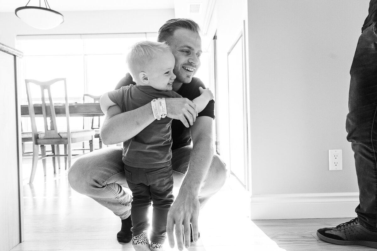 father and son smiling and laughing,  family documentary photography 