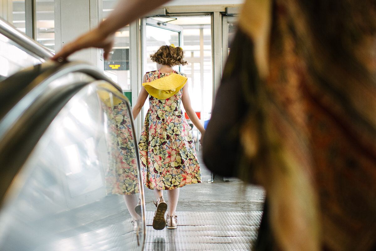 Little girl walking through subway station 
