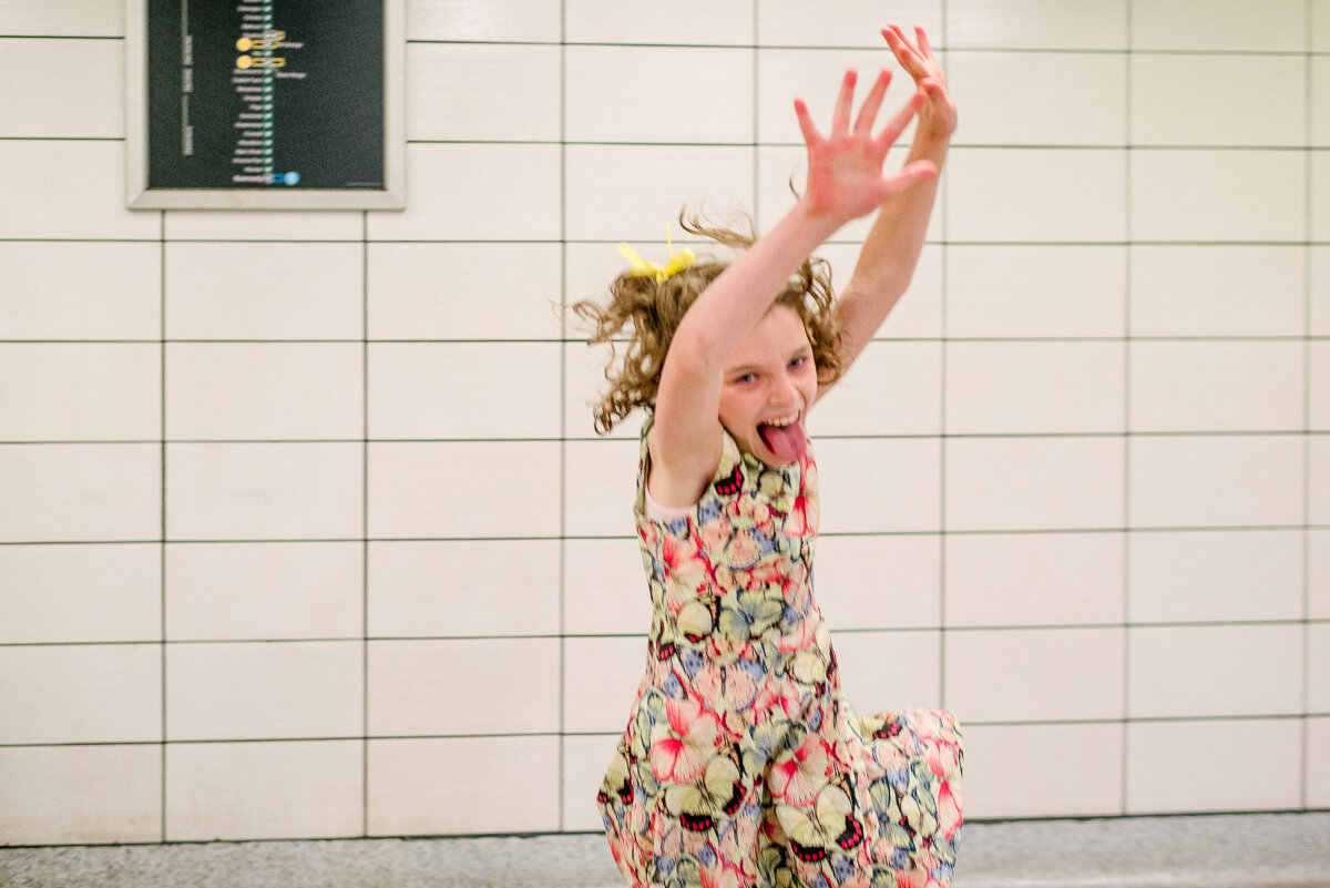 girl dancing in the subway station on the way home from a busy day in Toronto 