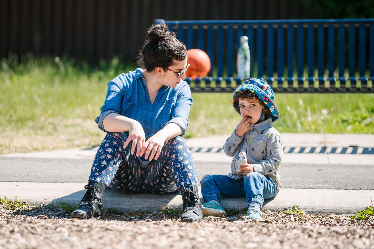 Mother and son sitting in the park