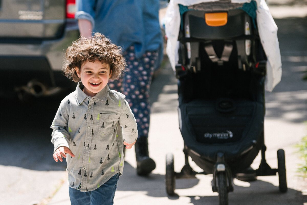 Boy running on the street happily