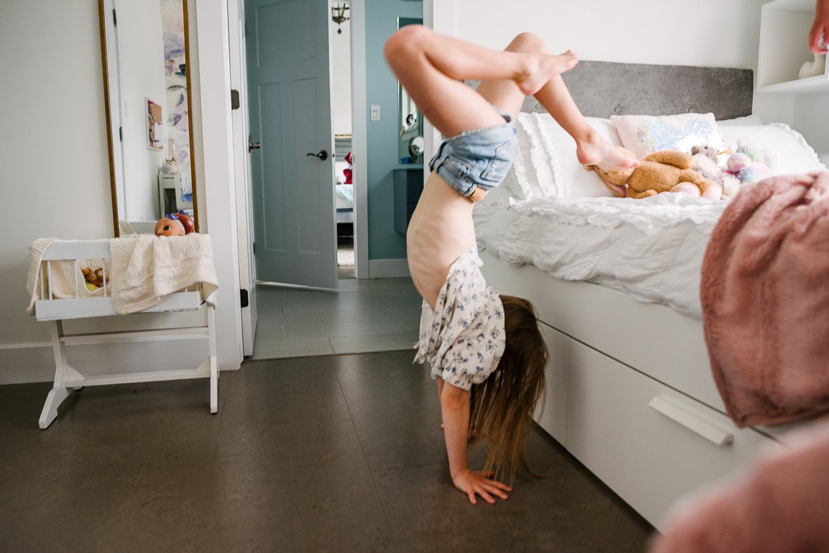 Girl doing stunts while playing, kids playing in bedroom