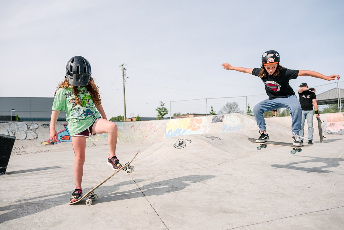 Two small girls skateboarding like professionals