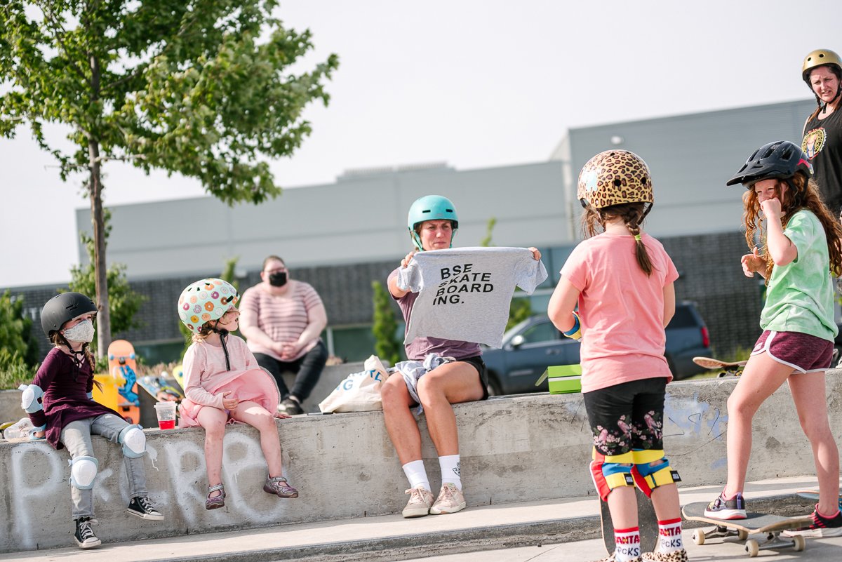 Group of girls learning skating from the instructor.