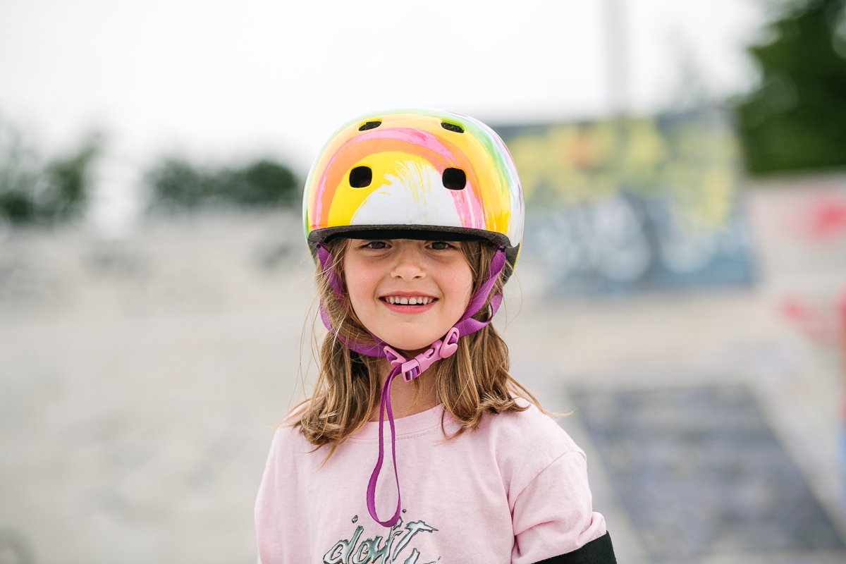 Cute girl smiling wearing helmet in the sports wear.
