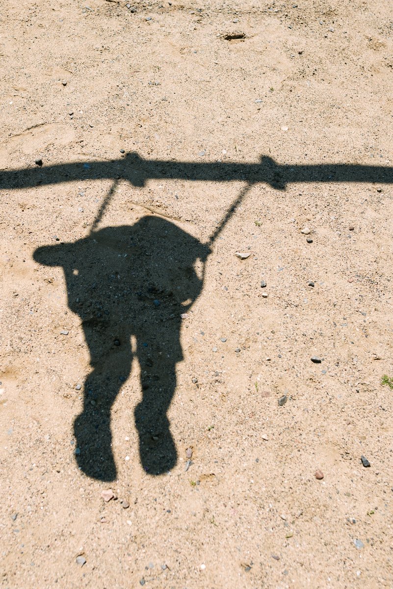Shadow of the child swinging