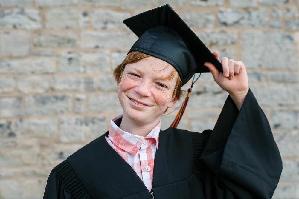 School boy posing on his graduation ceremony