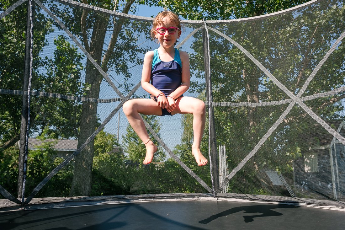 Kids jumping at the trampoline. 