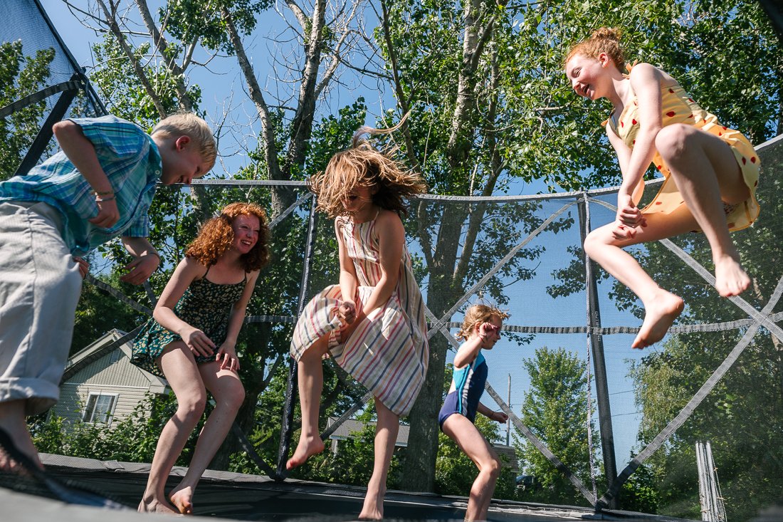 Kids jumping at the trampoline. 