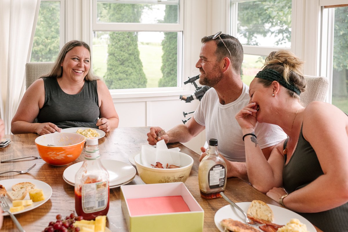 Family sitting in the dining area having lunch.