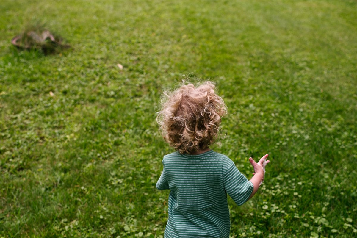 Little boy playing in the backyard