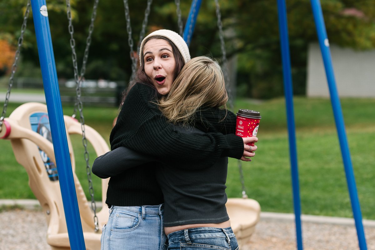 Woman hugging each other during photosession.