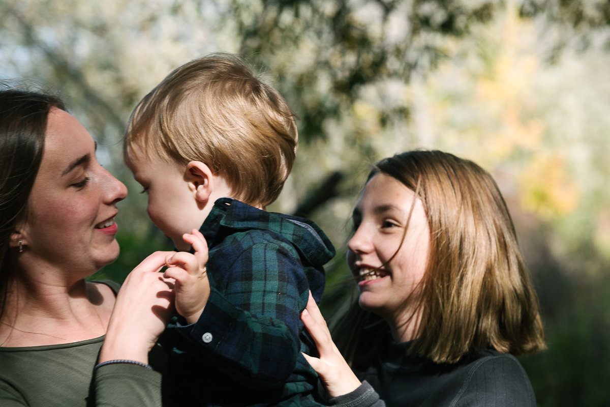 Woman with his little son in her arms.