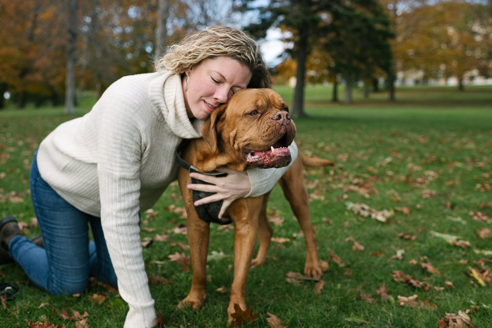 Mom hugging her fur baby in the park