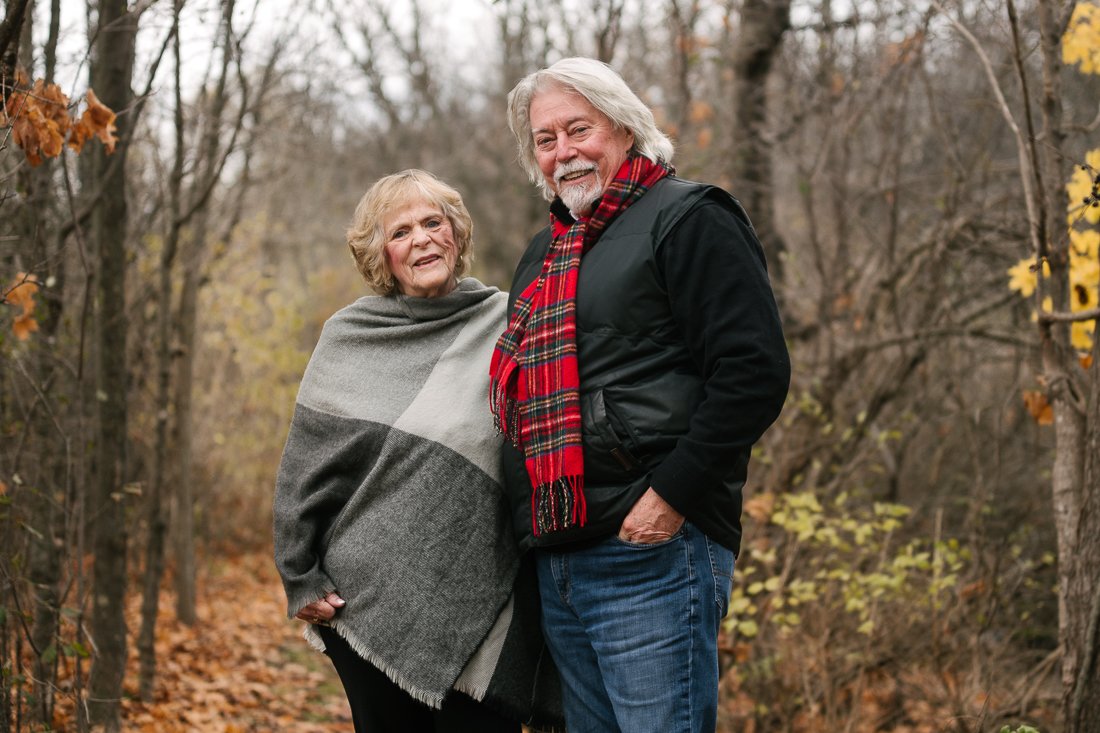 Old couple standing together in the garden for the photo shoot