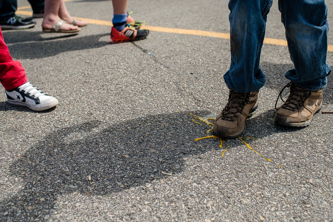 Man stepping on the fallen egg on the street