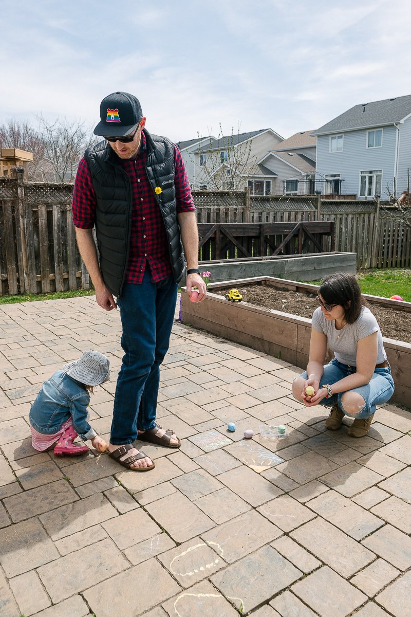 Little girl drawing chalk lines 