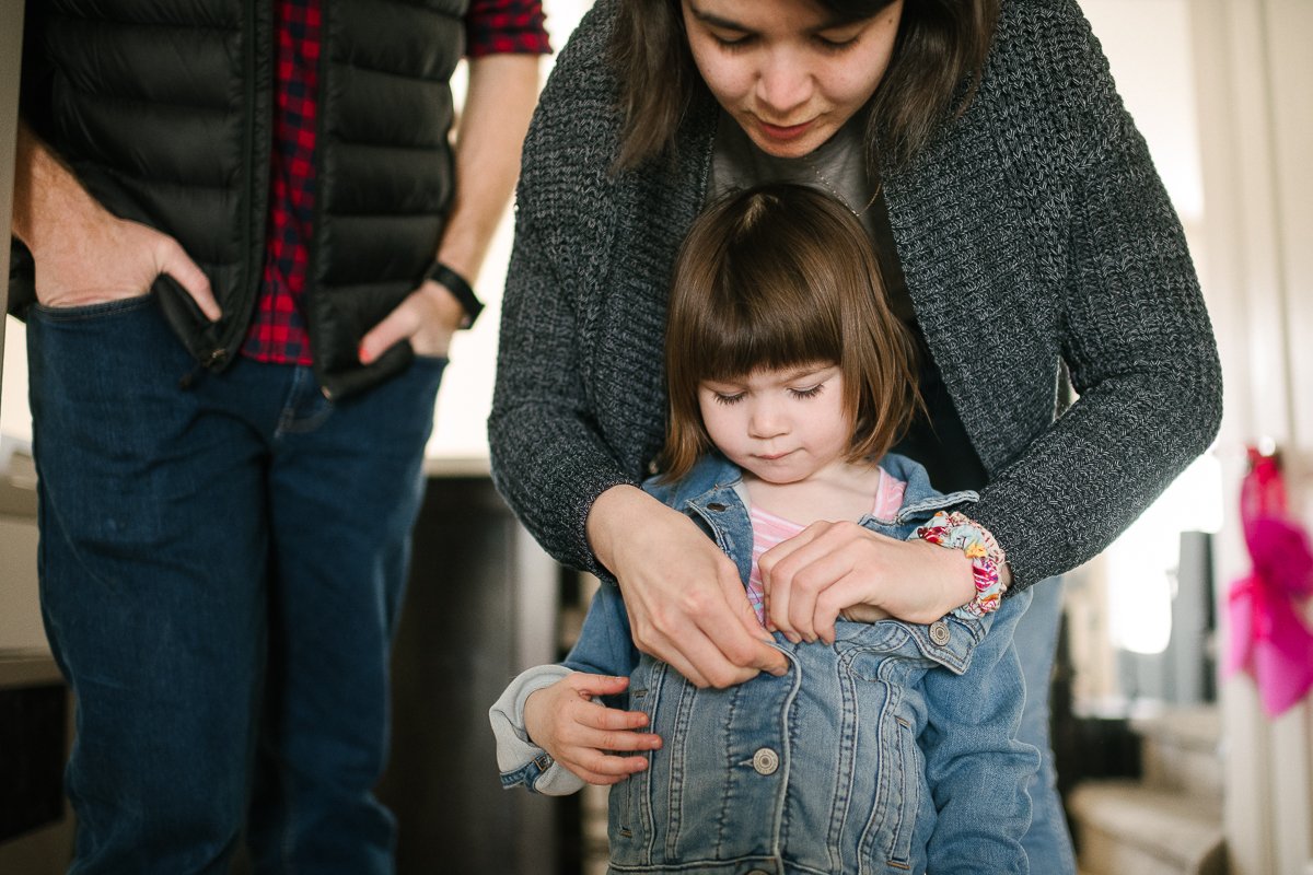 Mom getting her daughter ready for the photoshoot