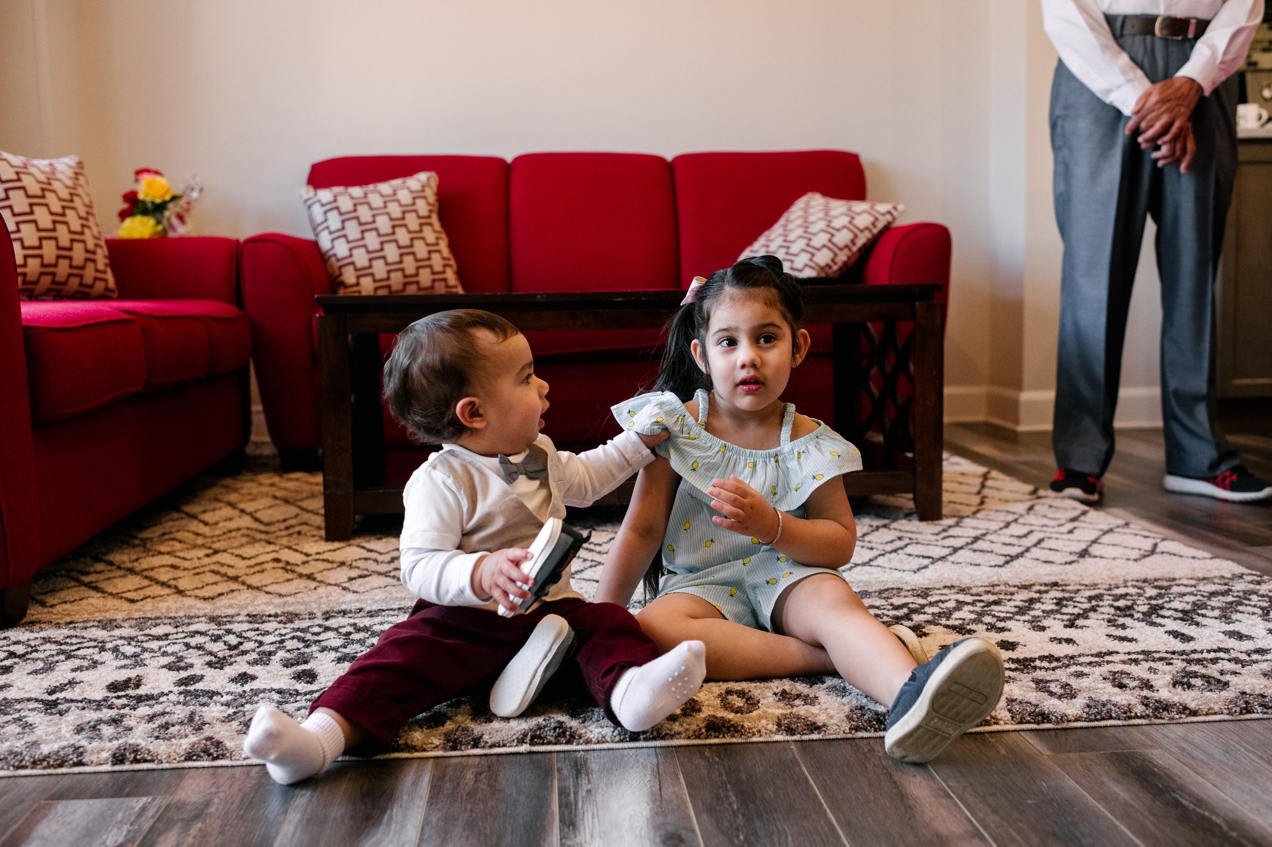 Brother sister playing together on the floor