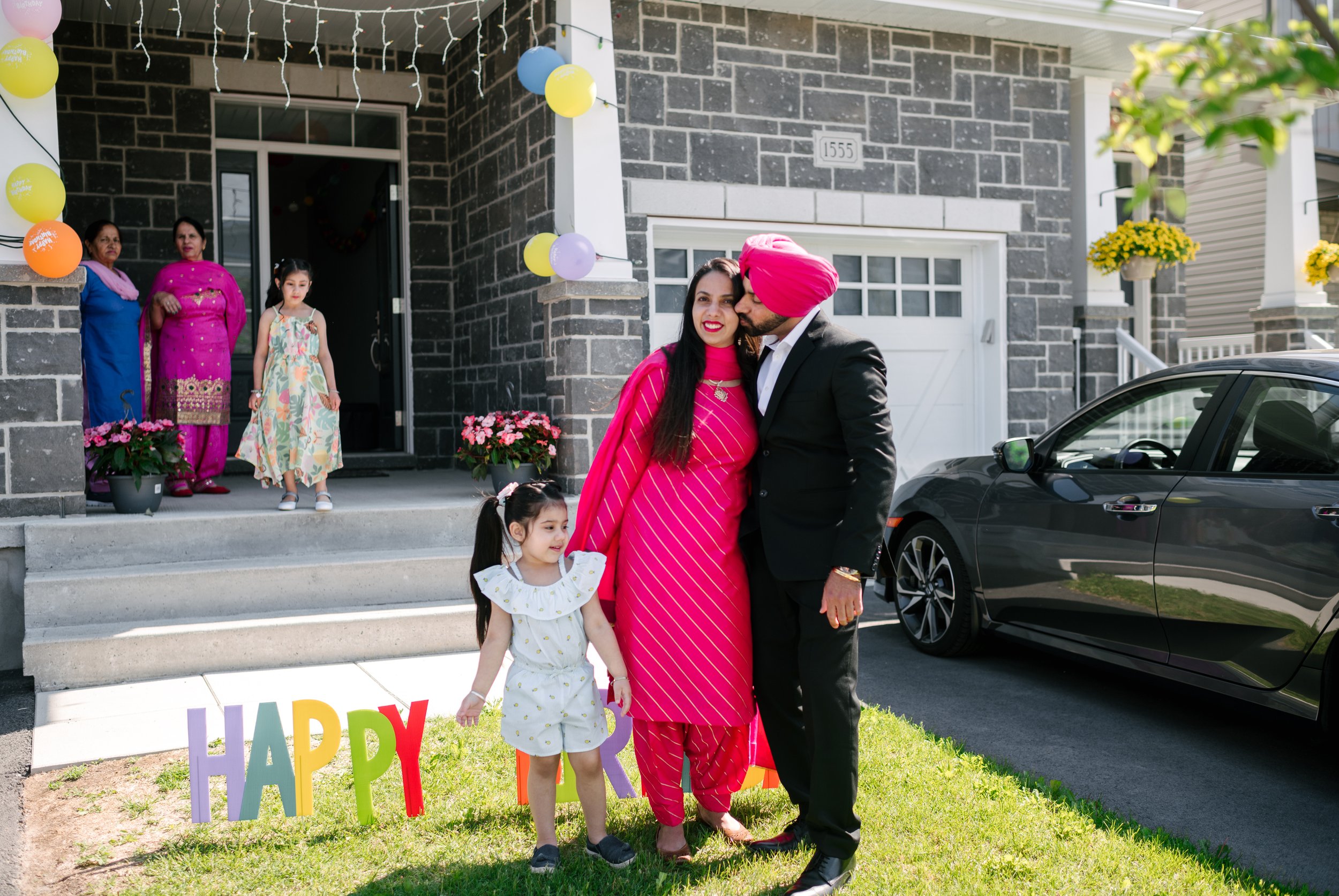 Husband wife and little daughter in the birthday party