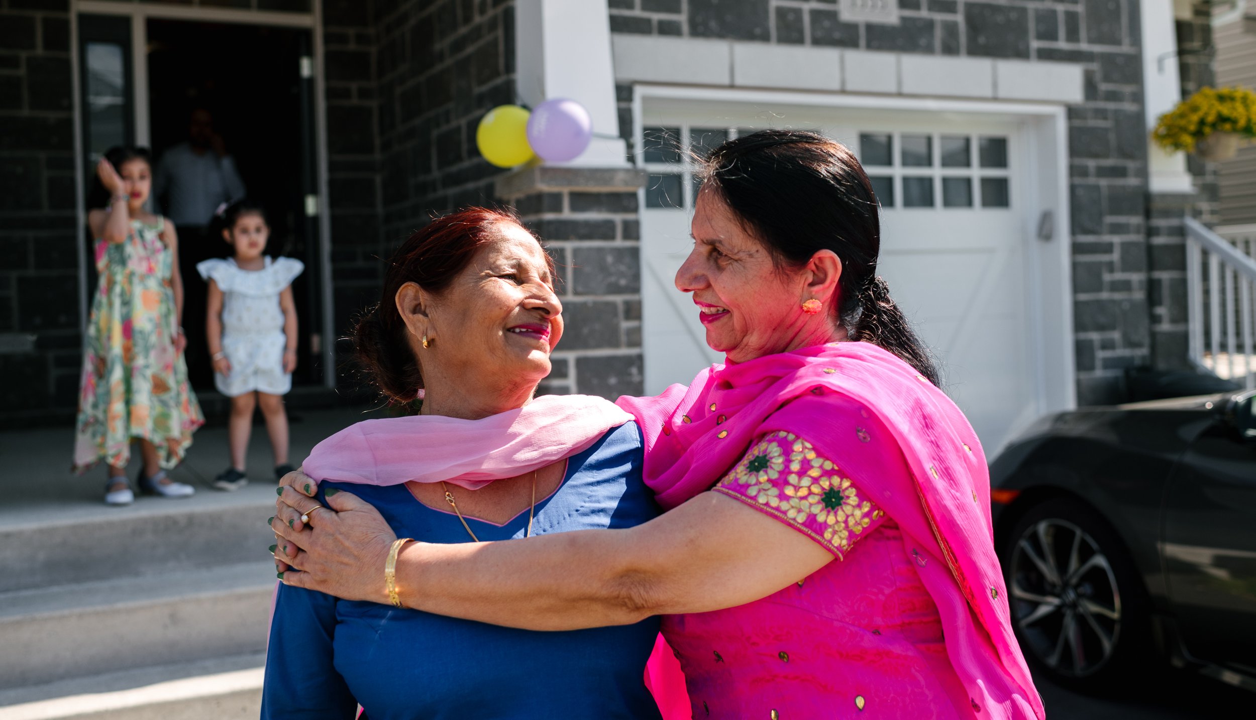 Indian women hugging each other in the party