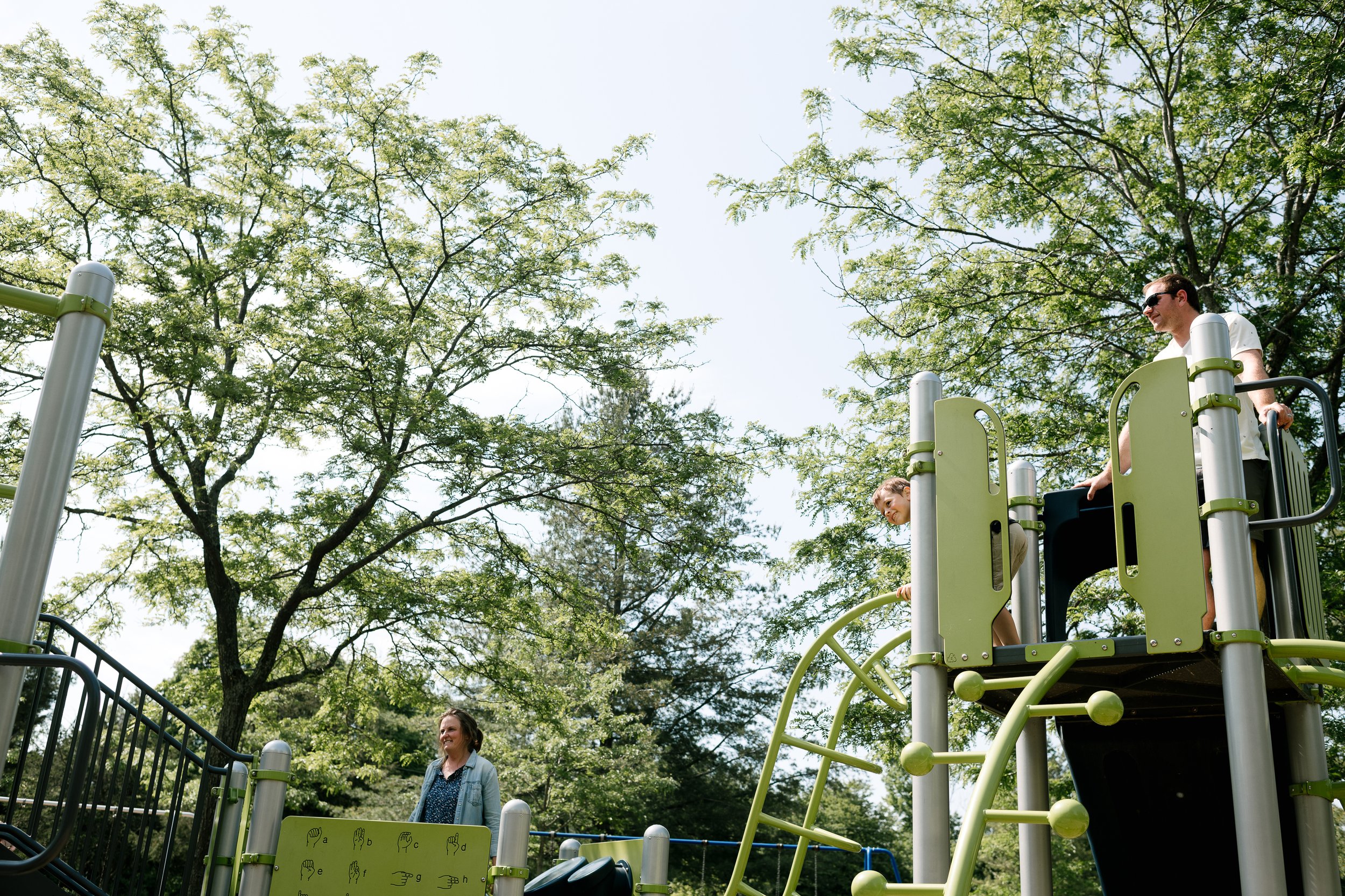 Kids playing in the park on the slide