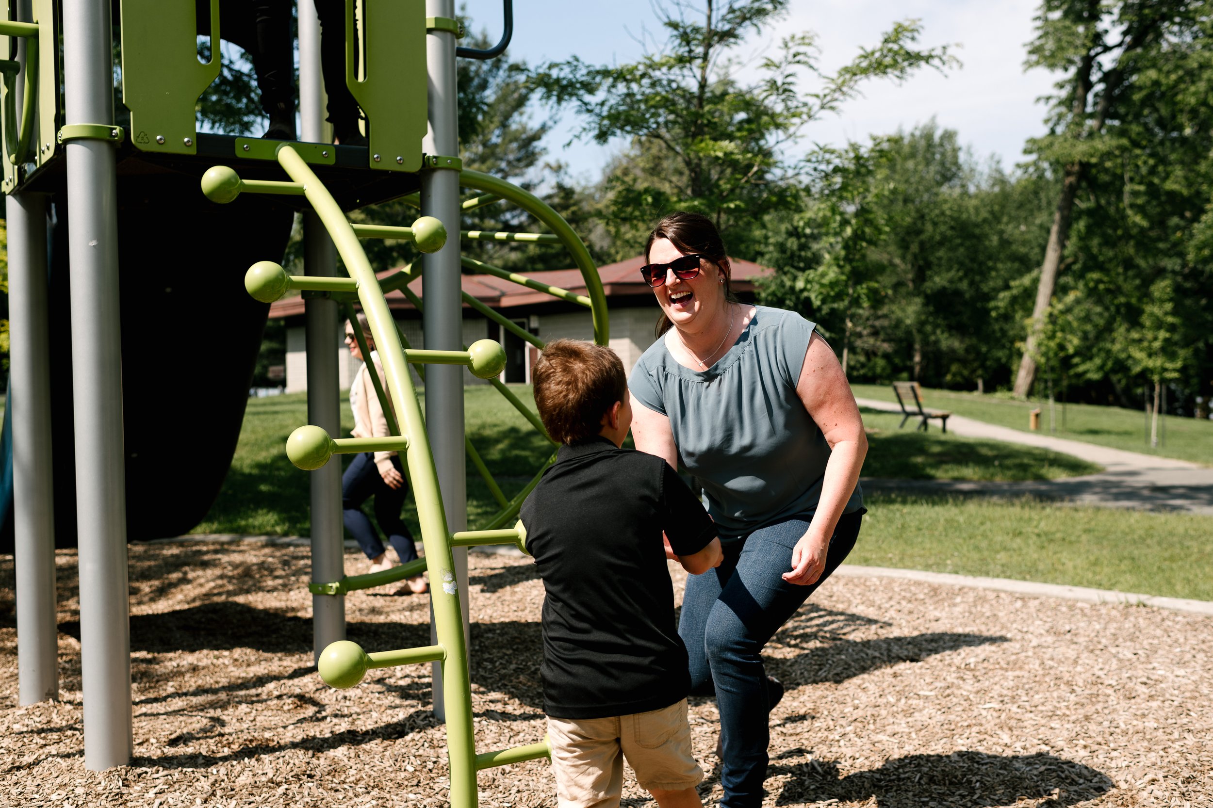 mom and son playing in the park