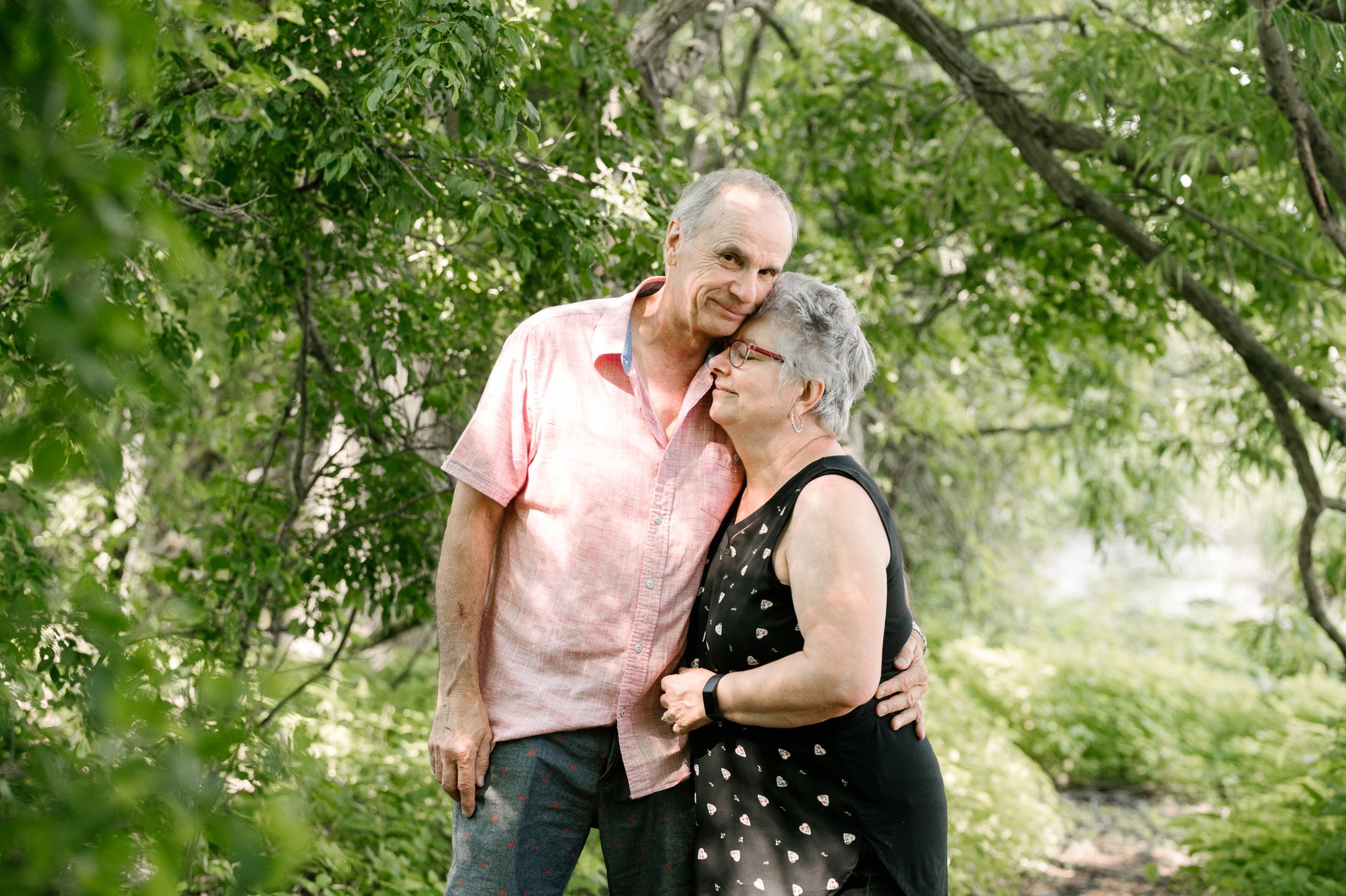 Old couple hugging in the park