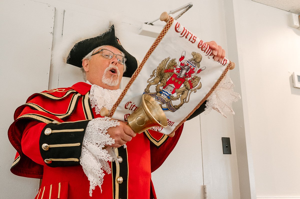 Town crier making announcement in the party. 