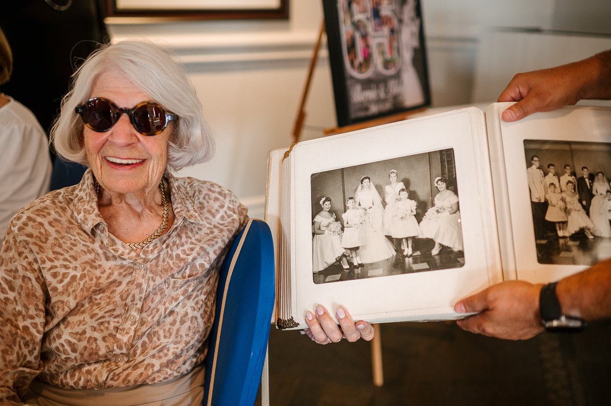 Couple watching old black and white pictures in the album.