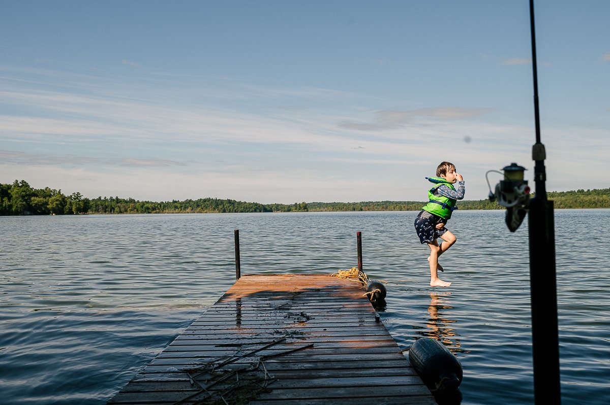 Boy jumping in the water when swimming.