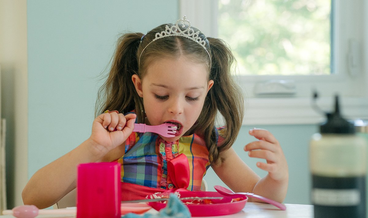 Boy and girl having breakfast.