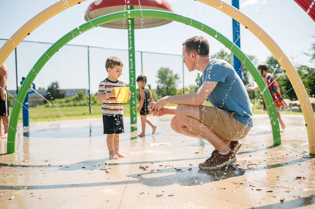 Boy and girl playing in the water park.