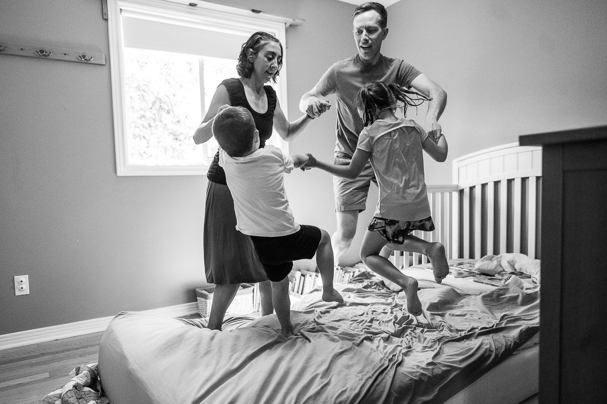 Black and white image of mom, dad and kids. 