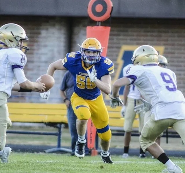 Alex Cleary (centre) recently swapped american football for rugby