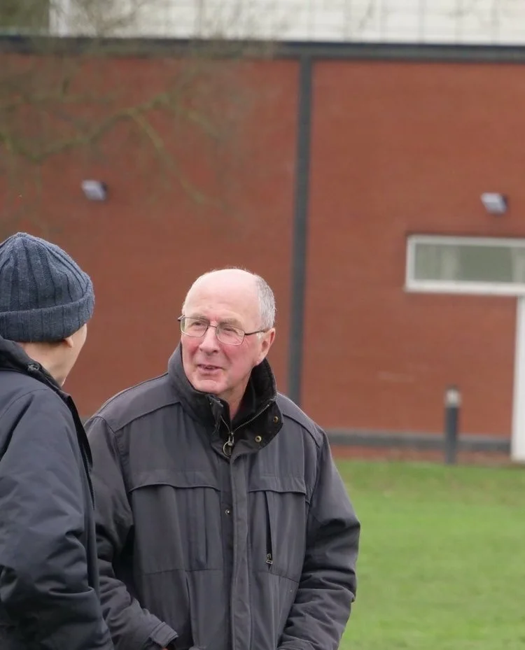 John Mooney (right), can often be found on the touchline of a local amateur rugby game.