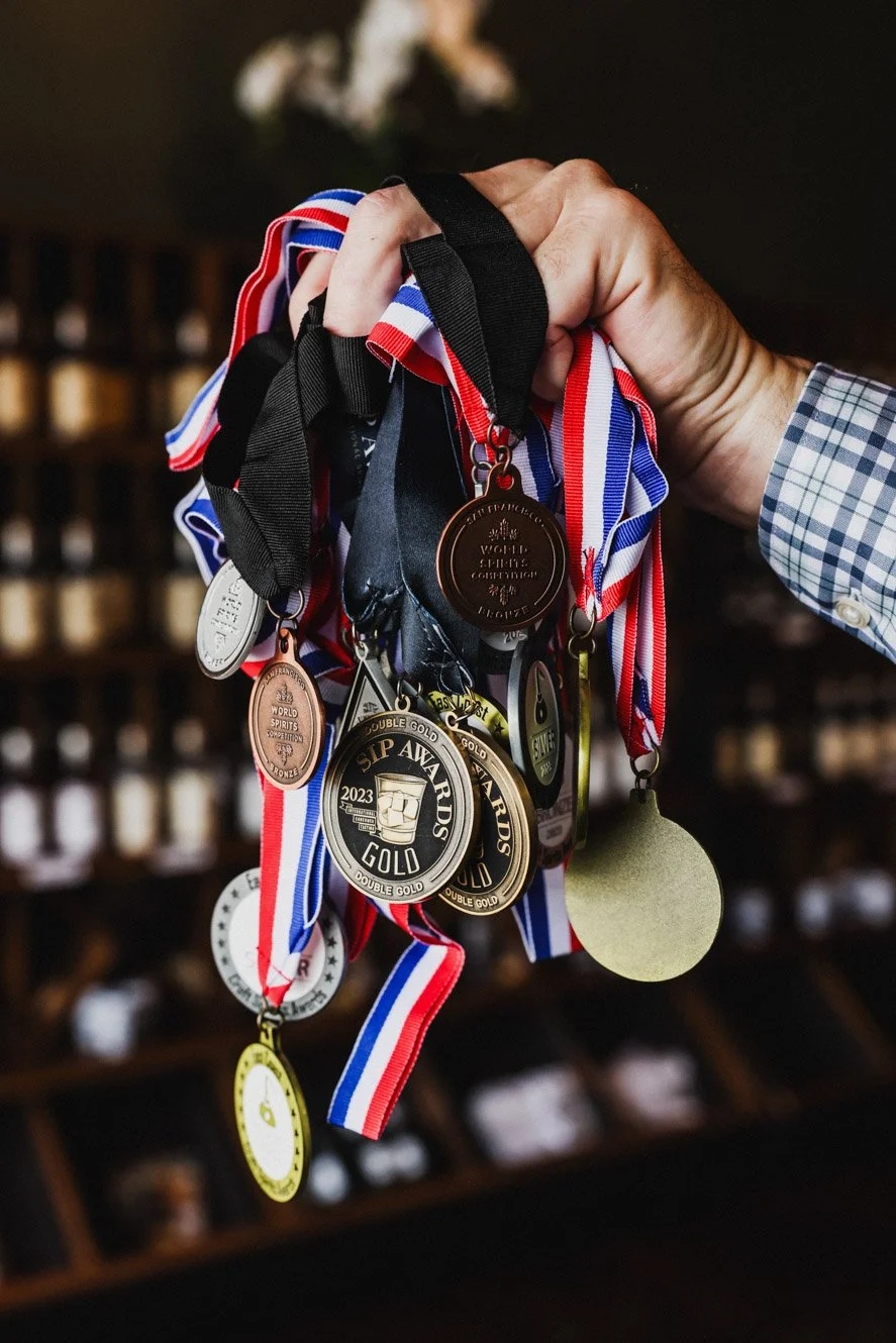  Medals won by 1861 at distilling contests, photographed by Daniel Shippey. Daniel Shippey is a professional photographer based in the southeast working primarily in Atlanta, GA + Nashville, TN + Thomasville, GA + Savannah, GA 