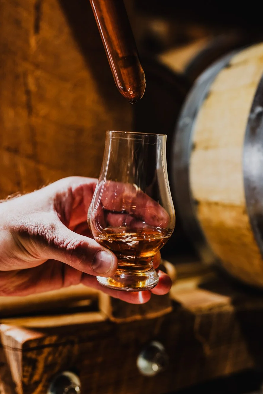  Whiskey thief device sampling fresh batch of whiskey at 1861 Distillery in Thomasville, GA - Photographed by Daniel Shippey for THOM Magazine.  