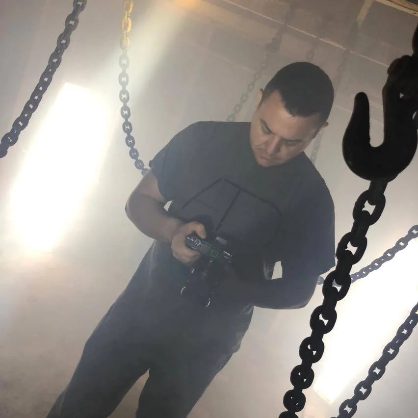 Nate reviewing and ensuring the settings are on point for the next take. 