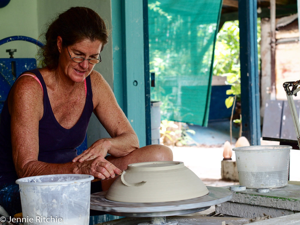 Nancy Nicholson working at her pottery wheel. Photo by Jennie Ritchie.
