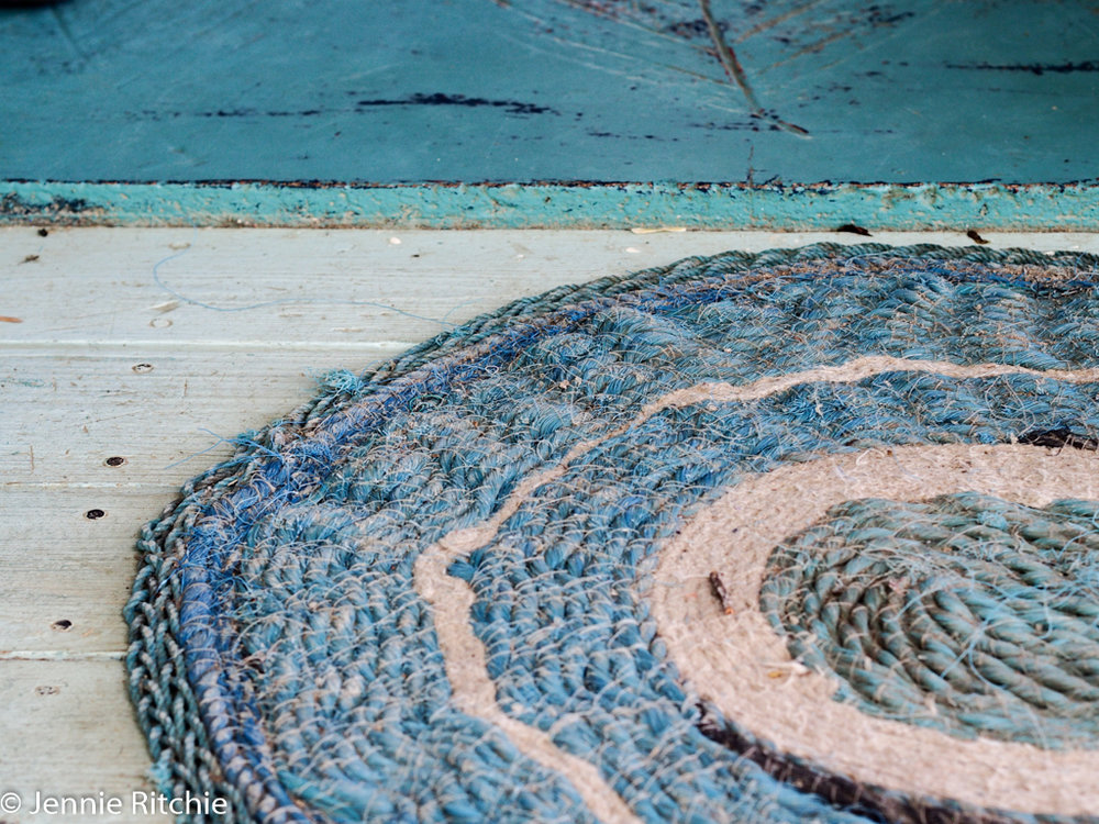 Blue handmade rope mat at the home of Nancy Nicholson. Photo by Jennie Ritchie.