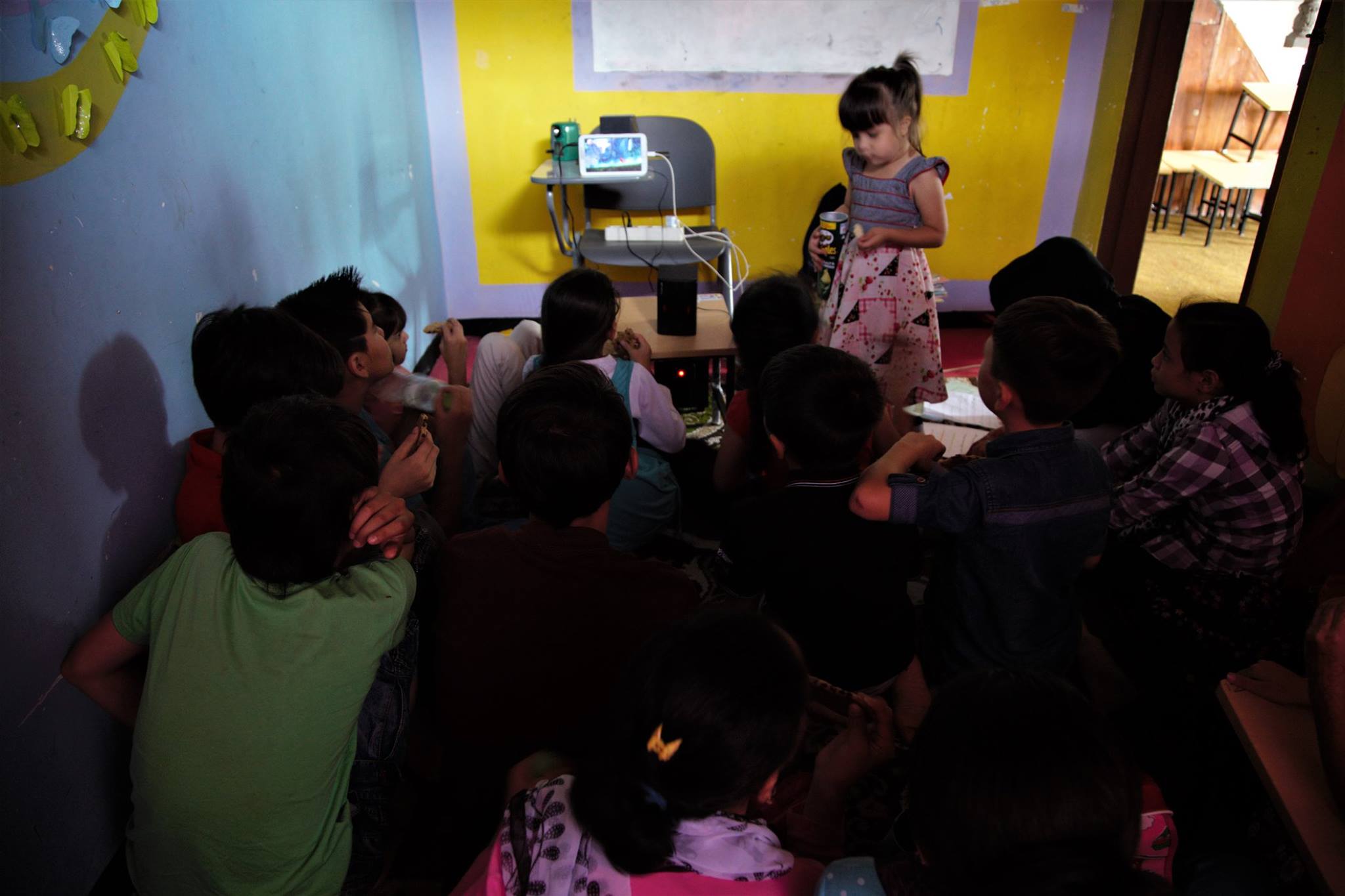 Our teachers, with limited resources, offered their tablets to be used as screen educational materials for the students. Looks like a mini cinema, even Natiqa enjoyed these sessions with older kids.