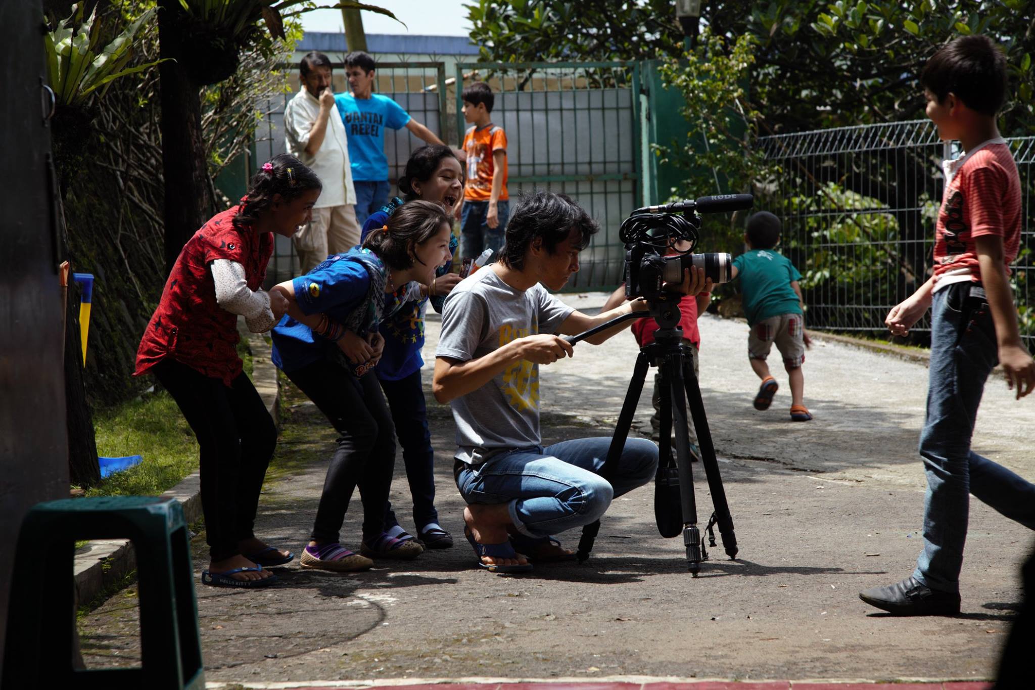  The students were so used to Khadim and his camera. 