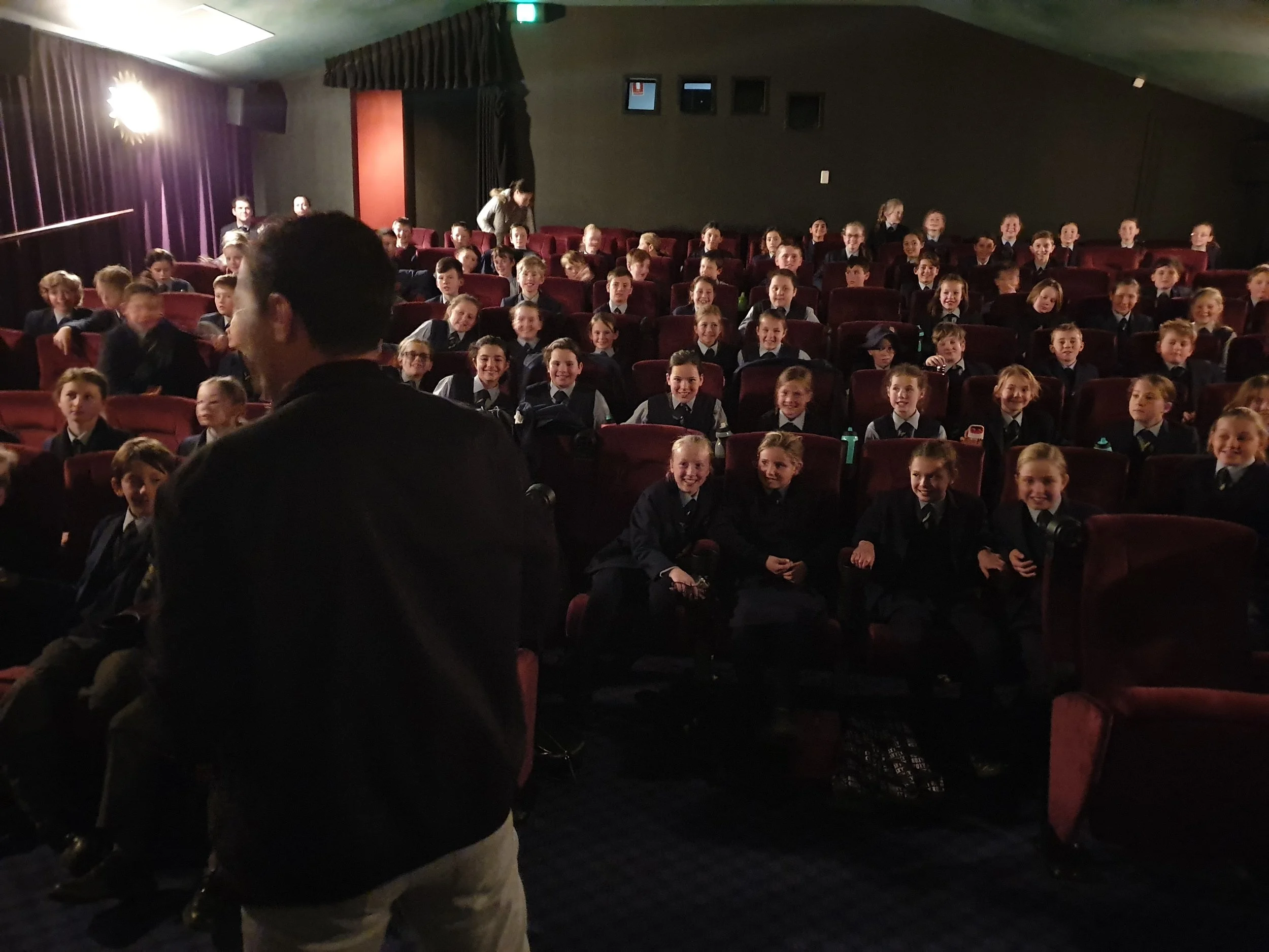 Muzafar speaking to one of 4 simultaneous full houses at The New Empire Cinemas .jpg